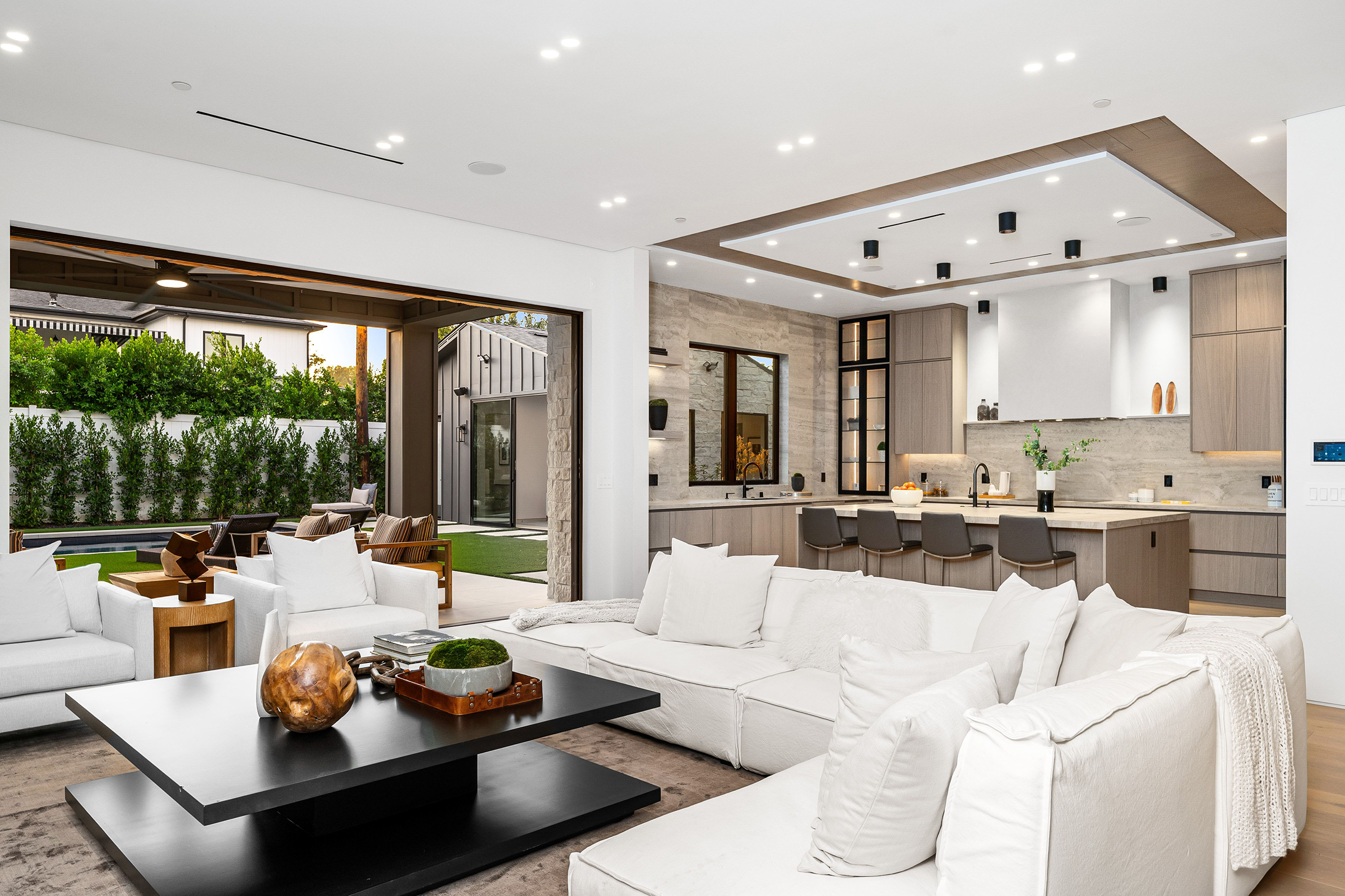 Modern open-concept living room and kitchen with luxury finishes in Woodland Hills