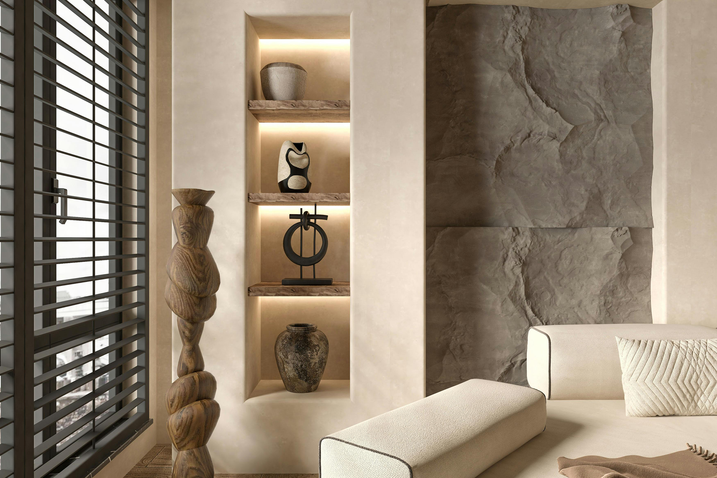 Minimalist neutral-toned interior with stone wall and sculptural decor in Hidden Hills